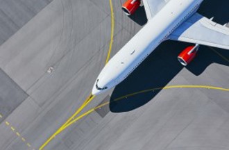Aircraft on runway with yellow lines
